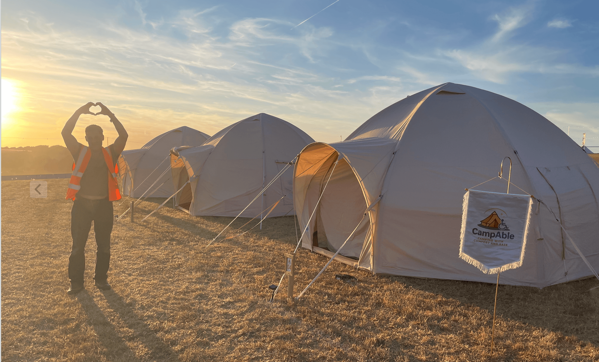 A row of CampAble tents at sunrise